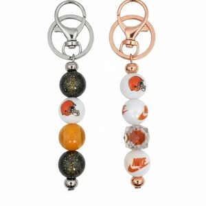 Nike Women's Silver and Orange Keychain Duo